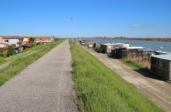 In the region Delta del Po, a natural paradise. An arm of the Po river, Po di  Goro, flows into the Adriatic sea. The village Gorino and traditional fishery. Italy, Europe.