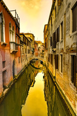 Fototapeta na wymiar Canal in Venice at sunset, Italy. Architecture and landmarks of Venice