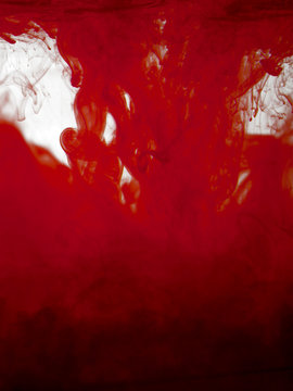 Red color pigment in water full frame