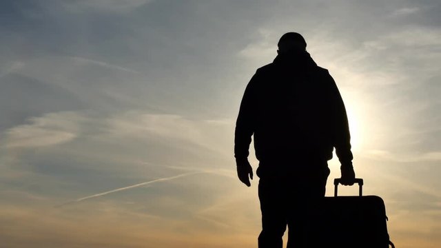 Man with trunk distancing and stops silhouette outdoors gimbal shot