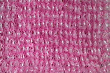 texture of bright pink yarn