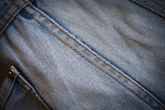texture shabby blue denim with yellow stitched thread
