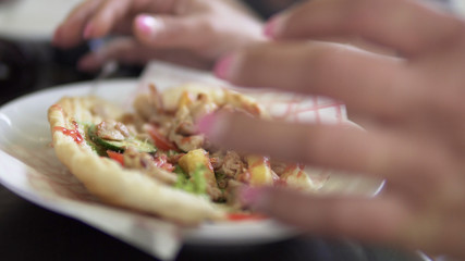 Woman eating Doner Kebab Sandwich
