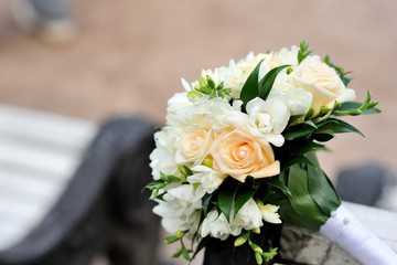 Bouquet of a bride on a white bench. Beautiful wedding bouquet. 