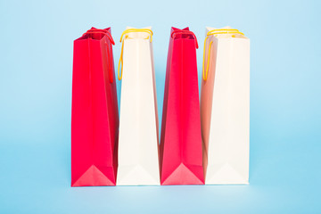 Paper shopping bags on blue background