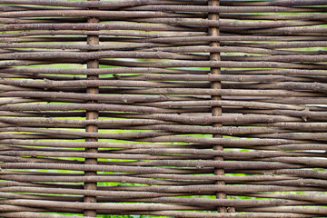 Wooden brown texture of thin rural fence rods