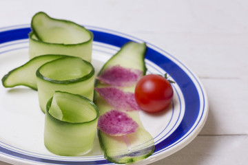 a dietary salad made from pieces of twisted cucumber