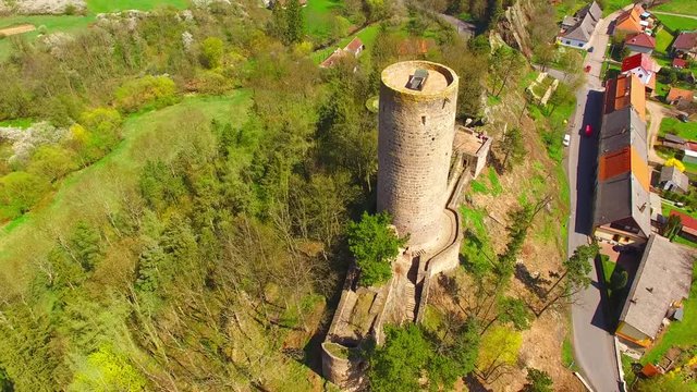Drone flight around Zebrak Castle. A ruin of a Gothic castle originated in the 13th century. Since 1336 a royal castle, enlarged by Kings Charles IV. Czech famous monument from above. 