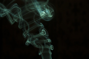 green smoke on black background