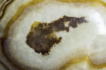 Macro photo texture of polished onyx stone. Photo for the site about geology, stones, jewelry, handwork, textures, art.