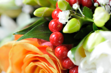 Beautiful bouquet with yellow rose and red beads. Wedding bouquet.