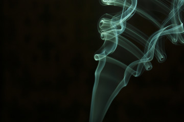 green smoke on black background