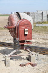 old electric concrete mixer and reinforcing bars