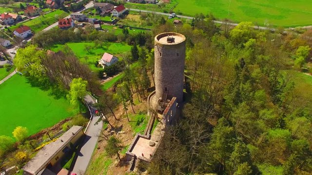 Drone flight around Zebrak Castle. A ruin of a Gothic castle originated in the 13th century. Since 1336 a royal castle, enlarged by Kings Charles IV. Czech famous monument from above. 