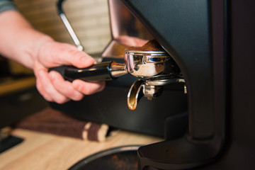 Fototapeta na wymiar Making coffee in machine in cafe