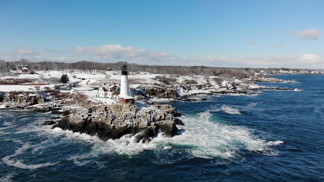 Aerial of Maine Lighthouse from Ocean - Winter