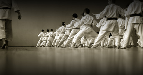 Kids training on karate-do. Black and white. Banner with space for text. For web pages or...