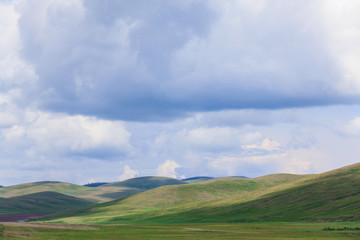 Fototapeta premium green hills under blue sky