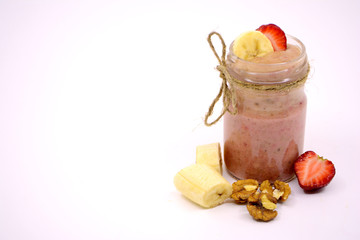 Smoothies with bananas, strawberries and nuts. Copy space