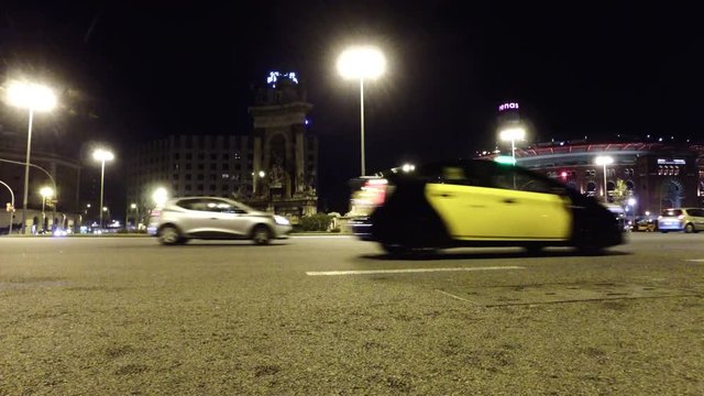 Night traffic at Plaza de Espagna with view of Old Arena building in Barcelona  Catalonia  Spain