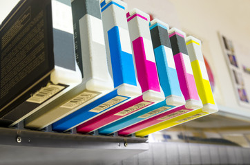 close-up shot of a CMYK ink cartridges for laser copier machine, injet plotter