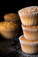 Muffins sprinkled with the powder sugar