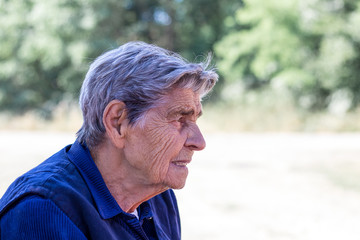 Senior woman looks off into the distance