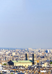 Aerial view over rooftops of Eglise Saint Vincent de Paul cathedral in Paris, France, seen from Monmartre hill, vertical