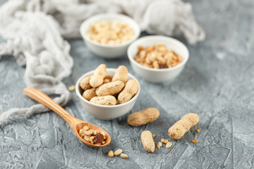 Different nuts on gray background