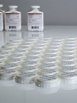 Pill bottle caps in a row
