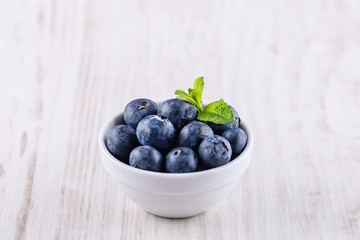 bowl with blueberries isolated on a white background