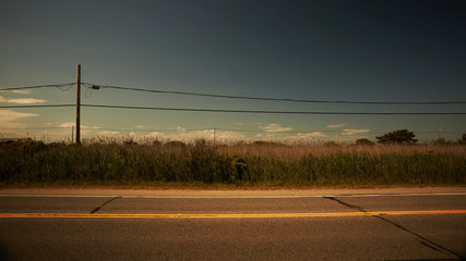 Power lines along empty road