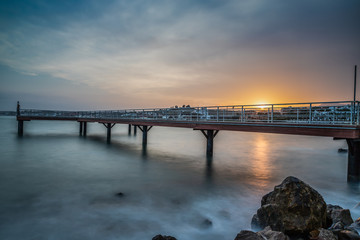 Fototapeta na wymiar Long Exposure of a Pier at Sunset.