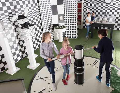 kids look for a way out in quest room in chess style