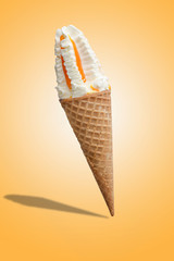 Vanilla ice cream with jam in a waffle cone. Bright color, summer mood.