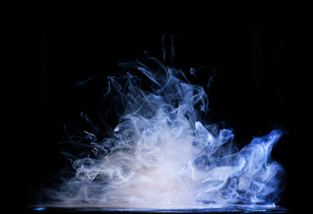 Ink and milk with paint in water swirl abstraction