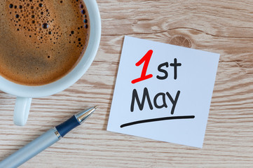 May 1st. Day 1 of may month, calendar on office or home table with morning coffe cup. Spring time, Internation labor day