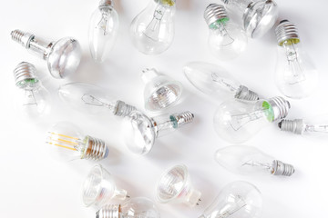 Lots of different light bulbs on white background.