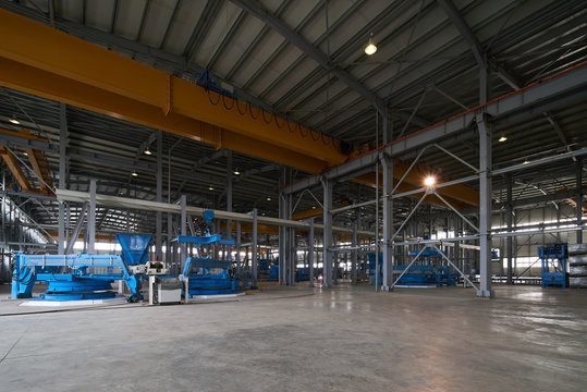 Large Warehouse interior inside a Factory building. Industry manufacturing concept