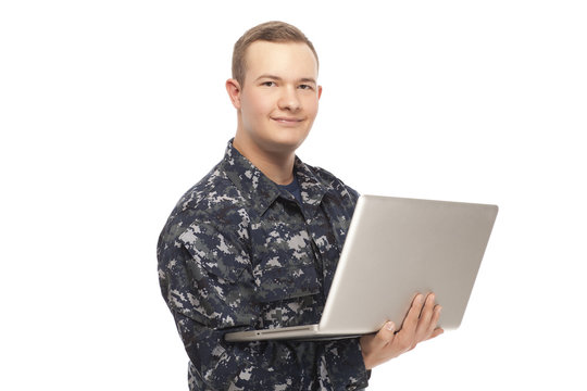 Navy man using laptop