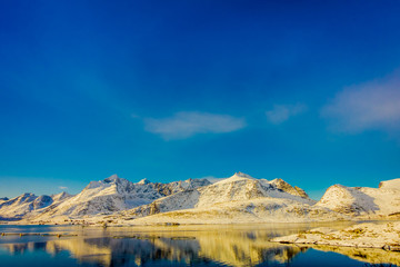 View of mountain reflecting in the water on Lofoten islands