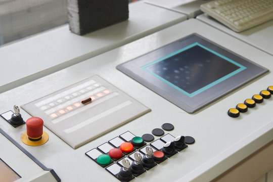 Control Panel With Buttons And Touchscreen In Control Room Of Factory. Close-up Of Working Process.