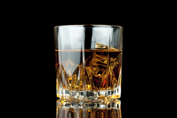 Glass of whiskey and ice.