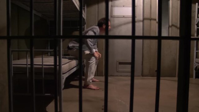 MAN PACING IN HIS JAIL CELL, MODEL RELEASE
