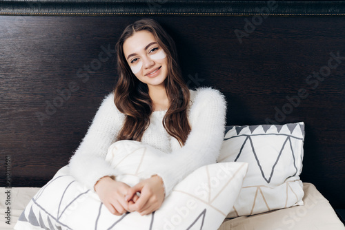 Beautiful Long Haired Girl Lies In Bed Early In The Morning Under