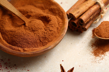Flavor cinnamon in wooden bowl