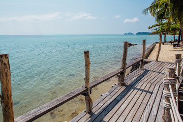 Paradise beach with wooden bridge