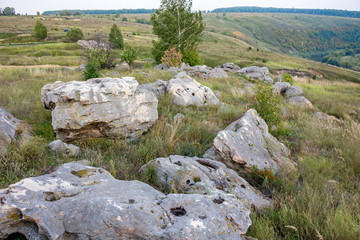 Sacred stones in the area of the village of Krasnogorye. The nature monument Witches stones. The valley of the Krasivaya Mecha River. Tula region, Russia