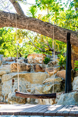 wood swing under the tree