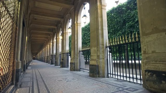 Passage at Place des Vosges, Place Royale lin Marais district. Paris, France